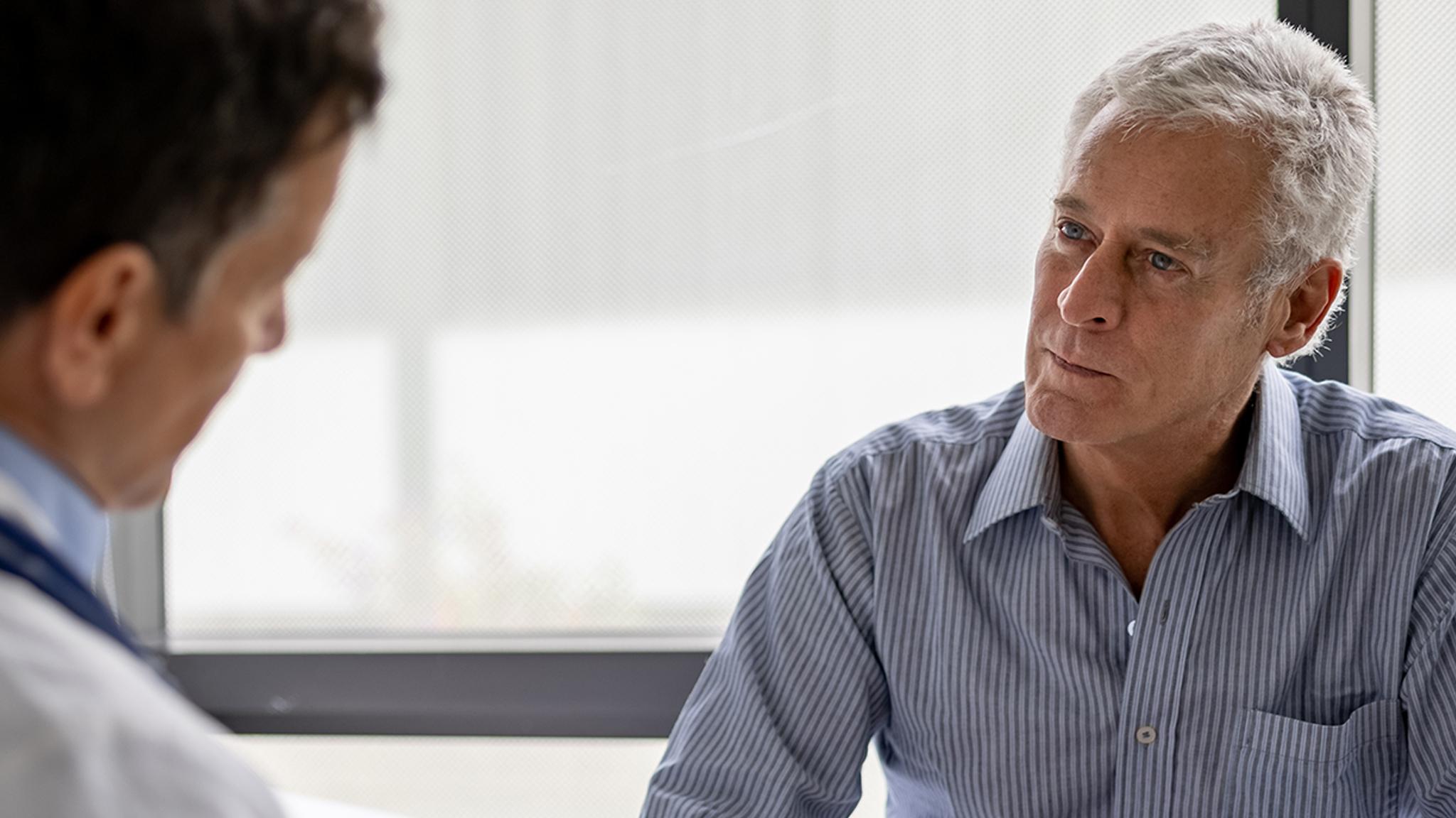 Pluvicto: Image of two male healthcare professionals having a discussion.